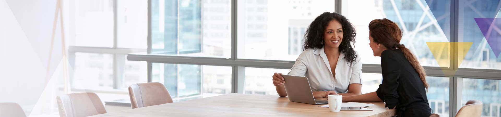 two women consulting two women consulting