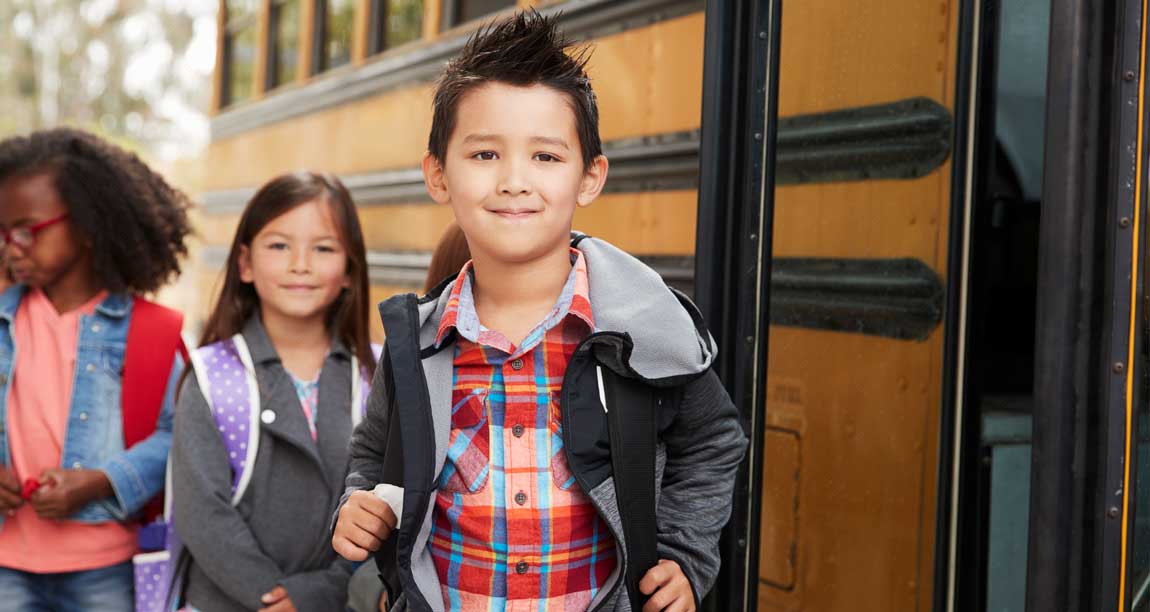 School children in front of bus