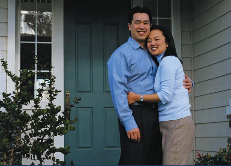 Couple_standing_outisde_of_their_home