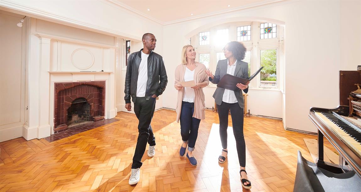 Real estate agent shows couple a house