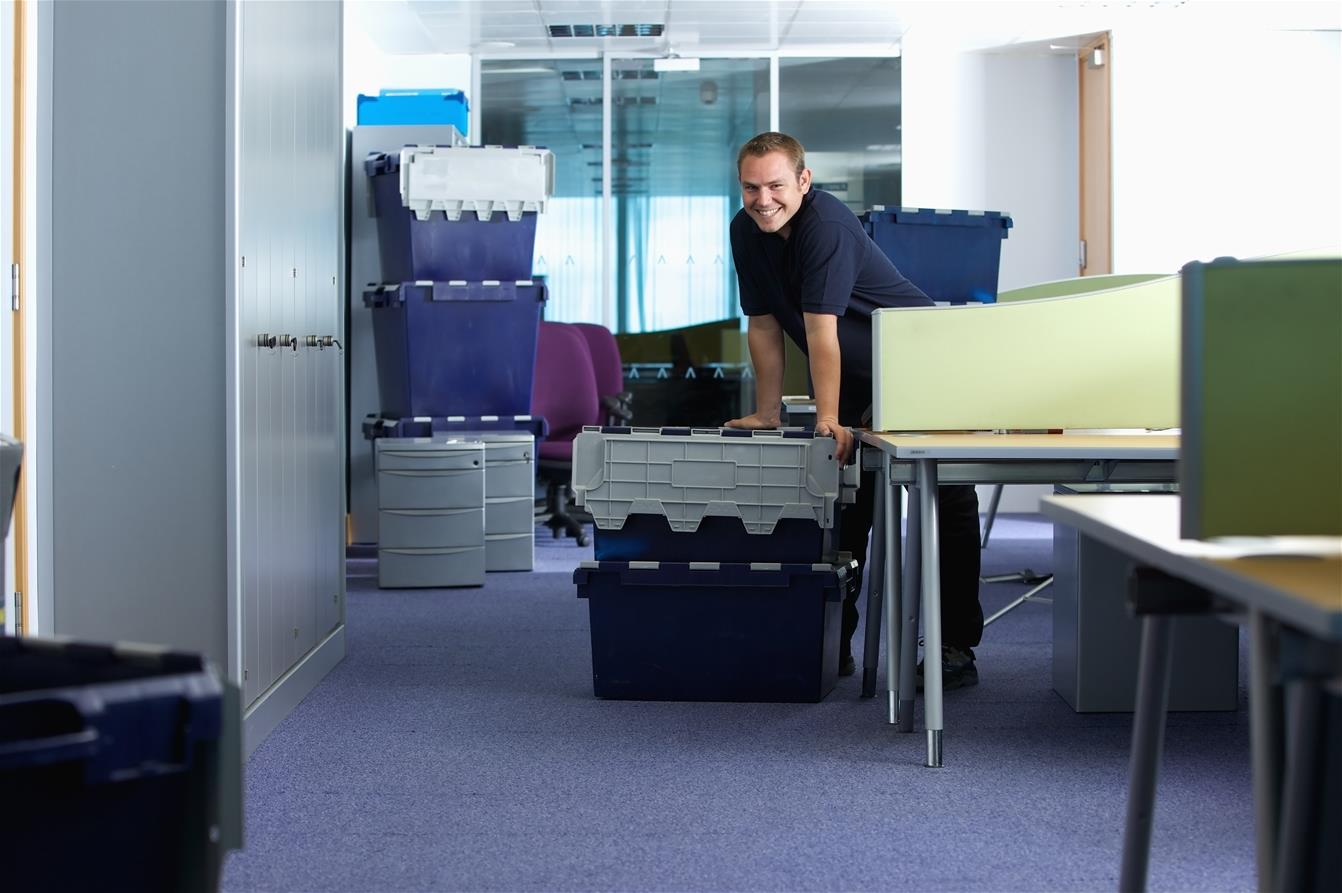 woman packing moving boxes