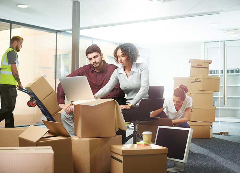 people packing up an office