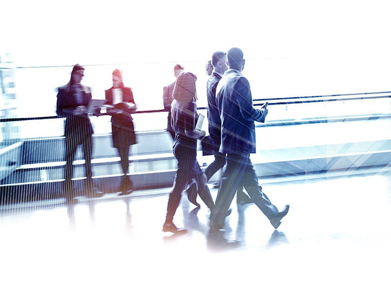 Men and women walking in a hallway